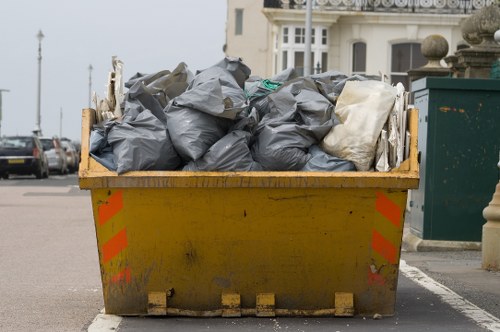 Crew preparing a flat clearance in West Ham with recycling bins
