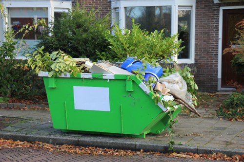 Clearance team handling electronic waste responsibly